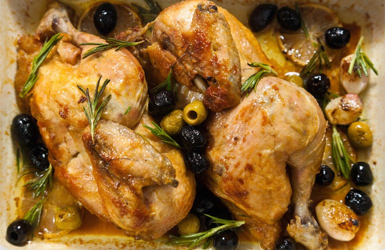 Cooked chicken legs on a pan