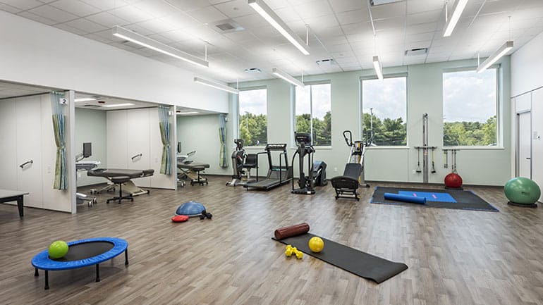 Workout room with ellipticals and mats