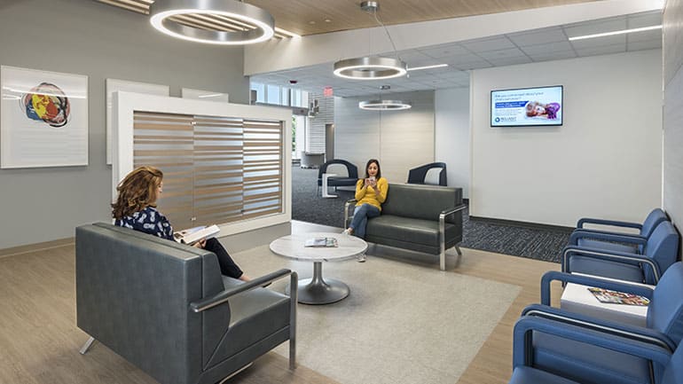Two women sitting in a waiting room