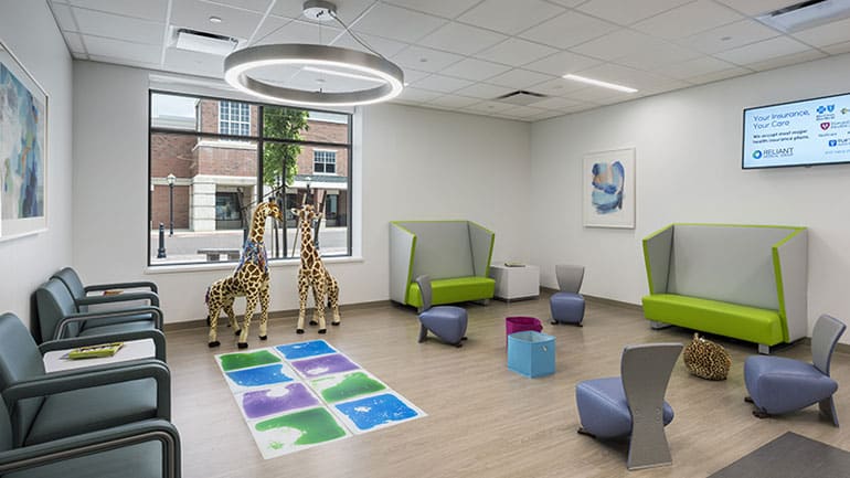 Waiting room with two giraffe toys